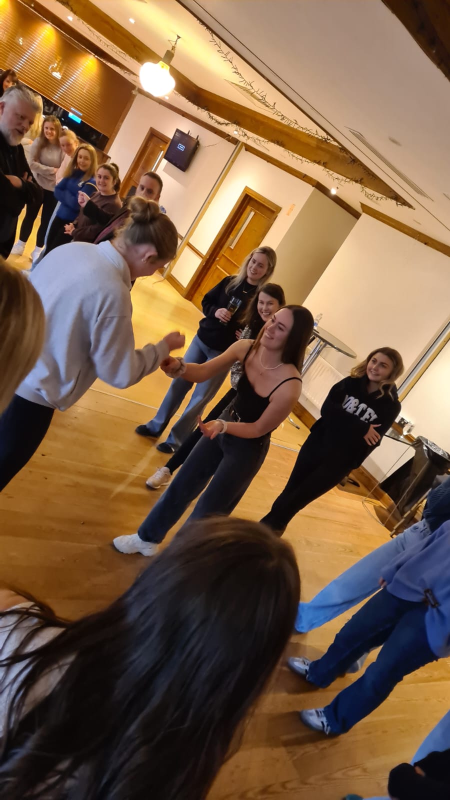 A group participating in an activity such as "In It To Win It" or "Battle of The Guests" or "Battle of The Bridesmaids", which are perfect group activities for a hen party, corporate event, or birthday party.