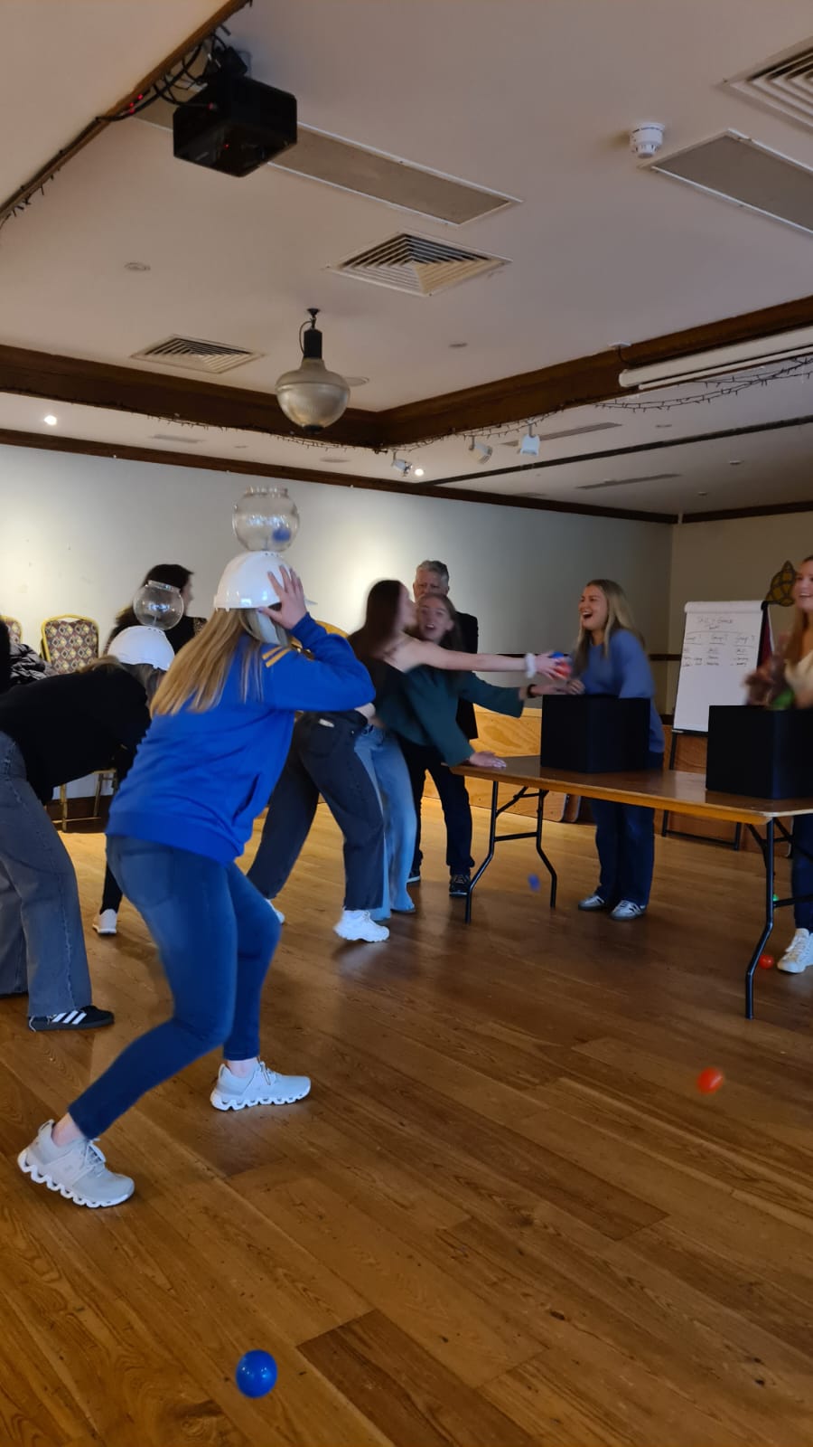 A group participating in an activity such as "In It To Win It" or "Battle of The Guests" or "Battle of The Bridesmaids", which are perfect group activities for a hen party, corporate event, or birthday party.