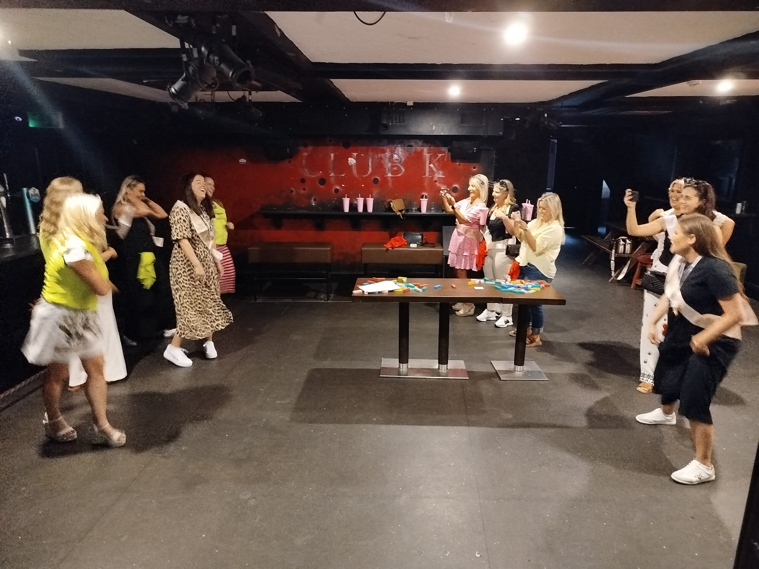 Hen party participating in an activity such as "Battle of the Bridesmaids" or "In It To Win It"